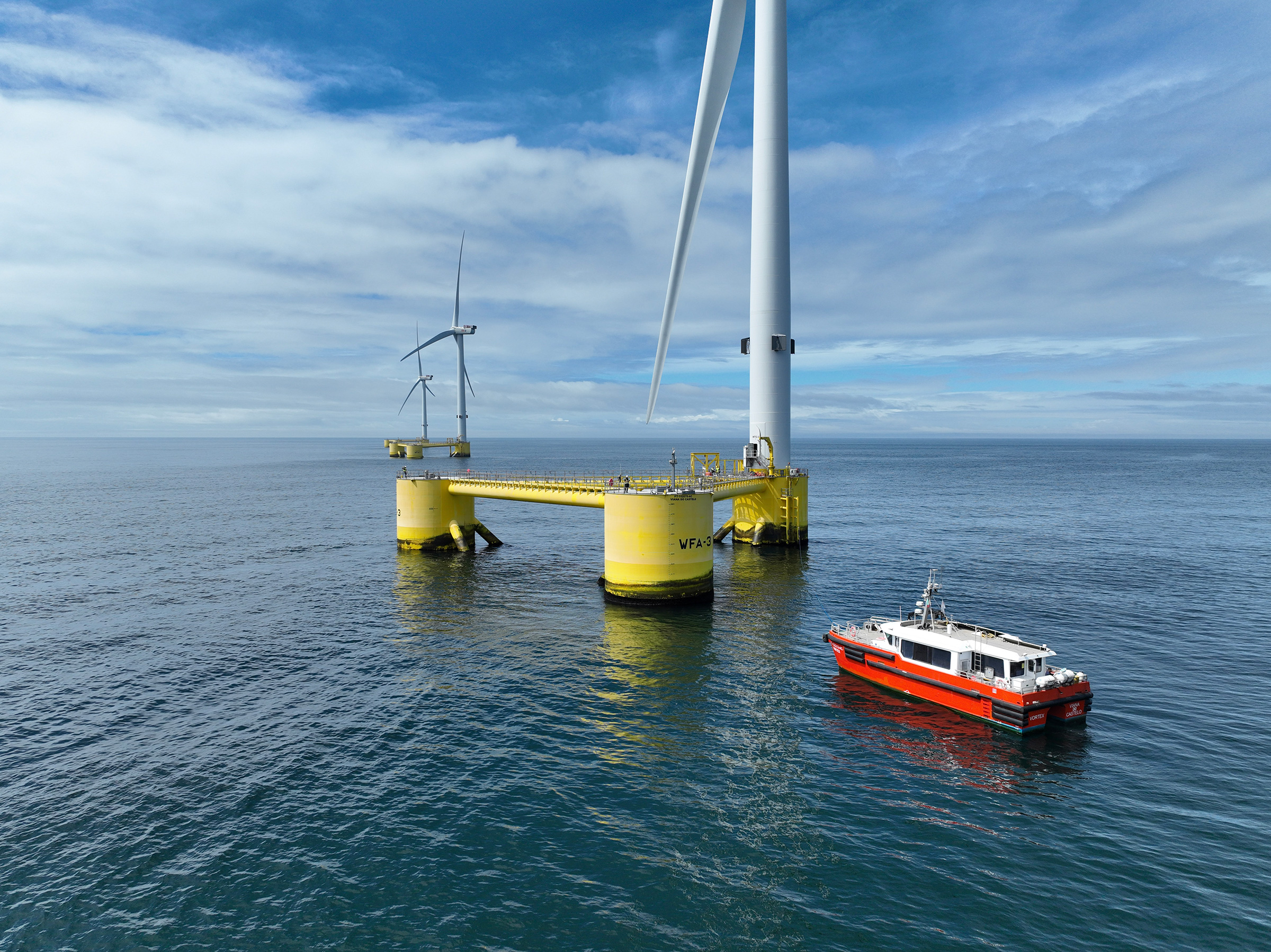 A CTV servicing the WindFloat Atlantic floating offshore wind farm. Photo of the WindFloat Atlantic project courtesy of Principle Power/Ocean Winds.